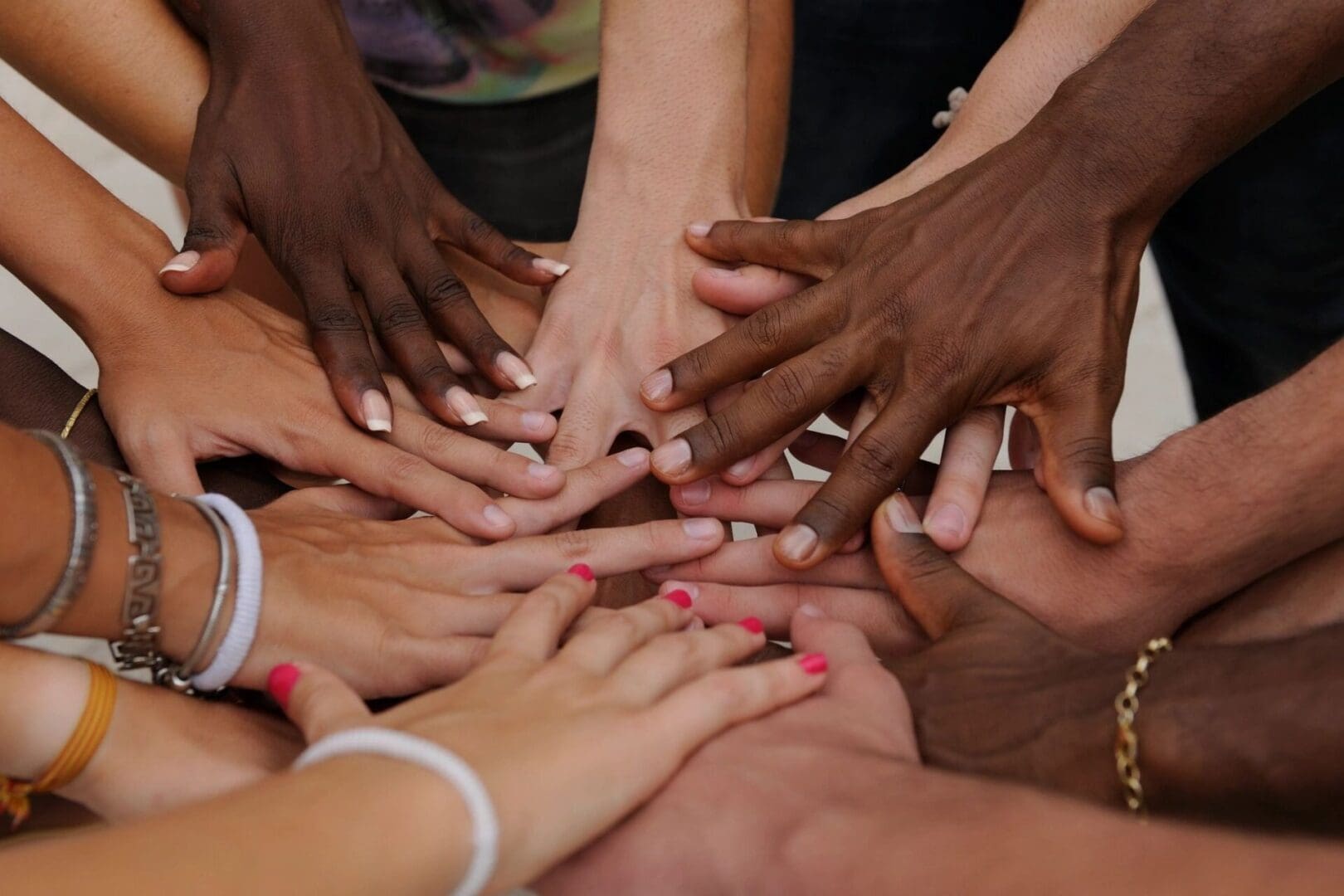 Hands clasped together in unity.