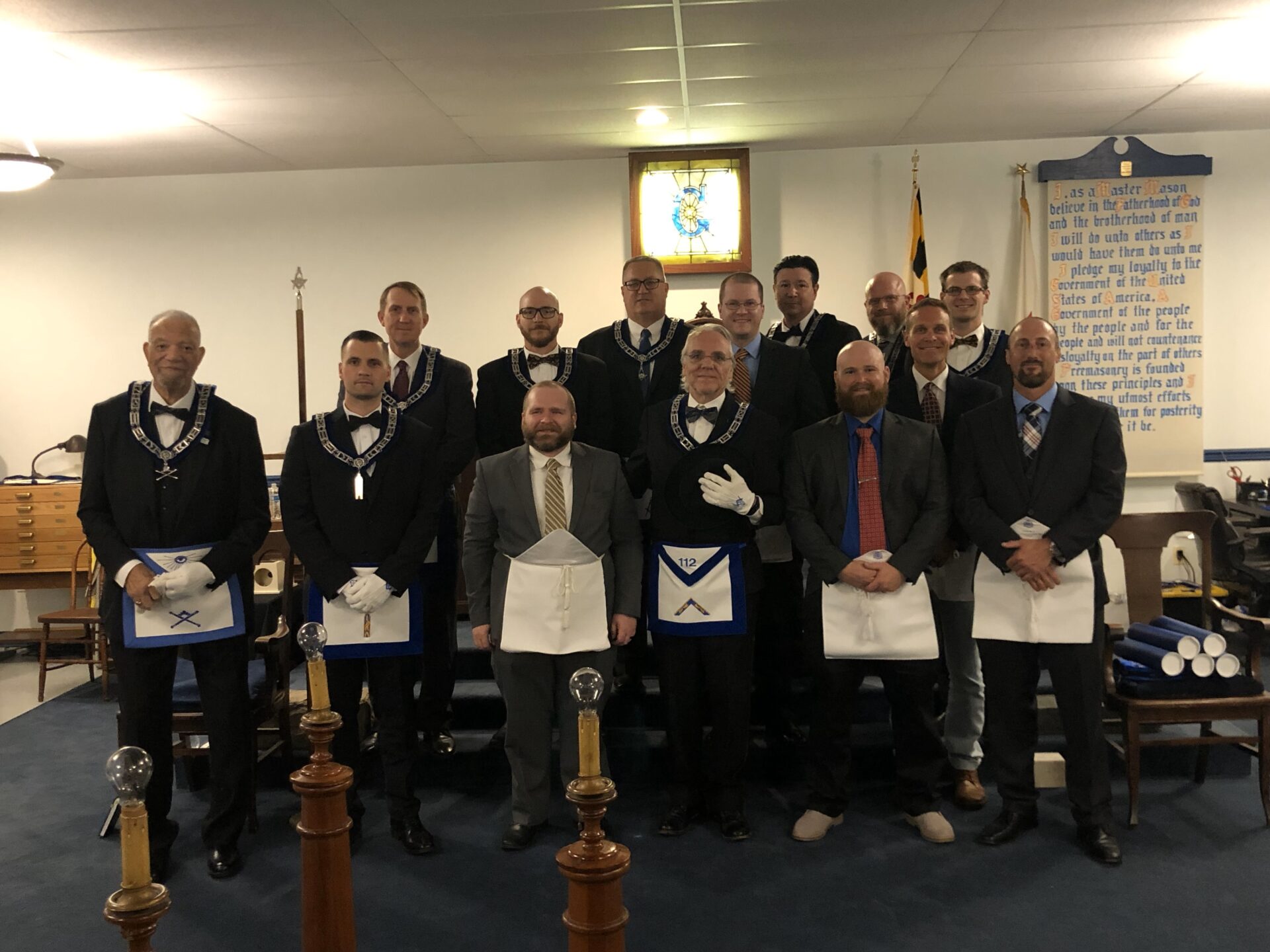 Masonic lodge members in formal attire.