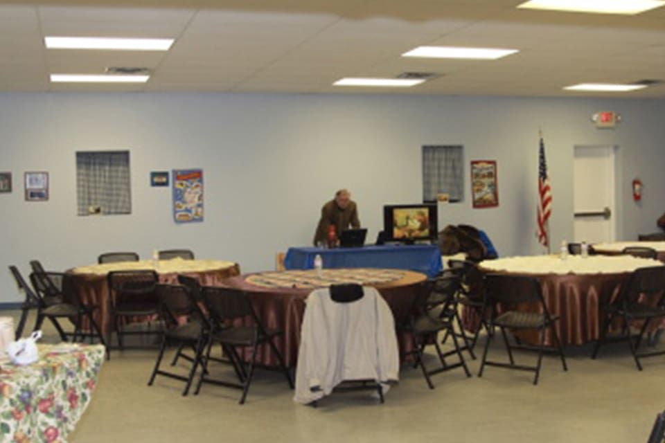 Meeting room with tables and chairs.